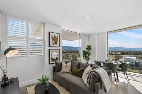 Host, relax, and recharge in the open-plan layout where contemporary design and seamless indoor-outdoor flow redefine apartment living.