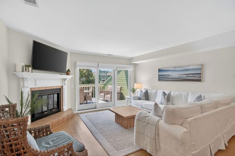Spacious living room with private balcony.