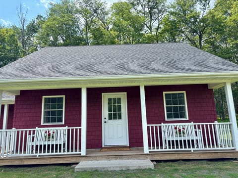 Country Cottage with porches and outdoor seating.