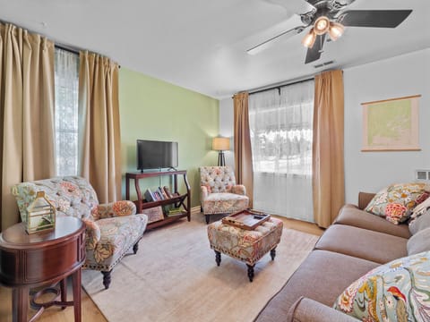 Enjoy our cozy living room with seating for six, smart TV, and books to read.