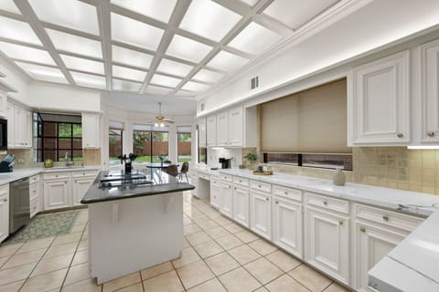 Gourmet Kitchen: Bright and spacious with modern appliances and charming garden views!