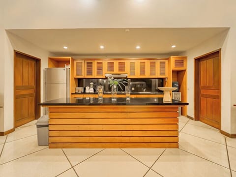 Kitchen

Adjacent to the dining area, the kitchen is designed efficiently with full amenities and direct access to the service/laundry zone — ideal for staff convenience and daily use.