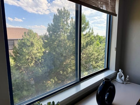 Primary Bedroom view with mature trees.