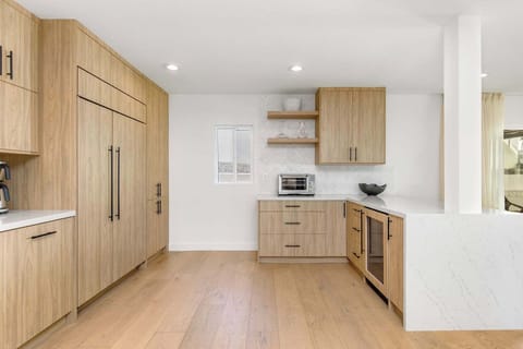 Let the chevron tile and custom oak cabinetry elevate every moment