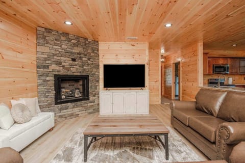 Your Living Room! Enjoy evenings by the stone fireplace and unwind in stylish, rustic elegance!