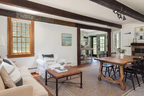 Dining area just off kitchen with cozy sitting area beyond