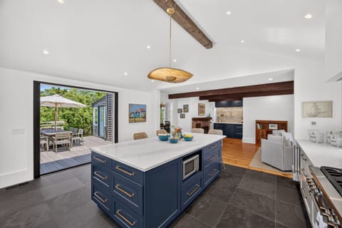 Beautifully renovated kitchen with slider to deck