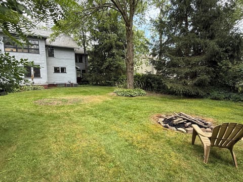 Firepit in the back with 6 adorondak chairs