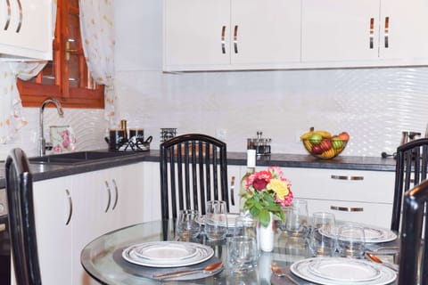 Fully equipped kitchen with everything you need to cook like home—plus a cozy breakfast nook.