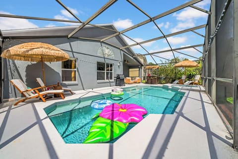Pool with sun loungers and inflatables