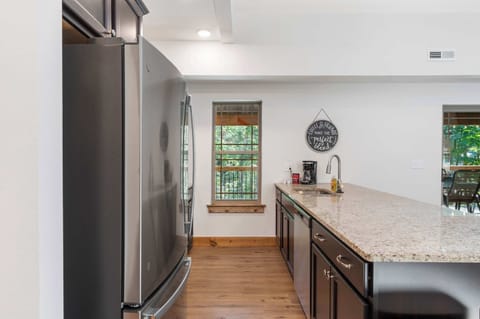 The chic, open kitchen offers ample space & every home comfort