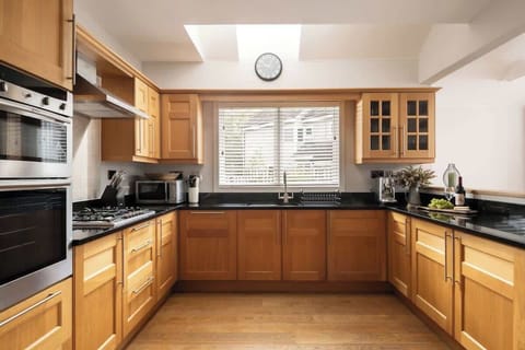 Morning light, coffee brewing, lake in view - this kitchen makes even the simplest moments feel special.