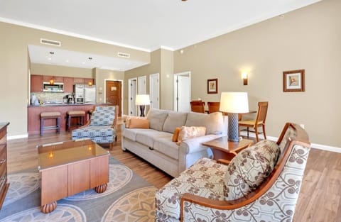 Elegant open-concept suite with cozy seating and modern kitchen design. HKK-104