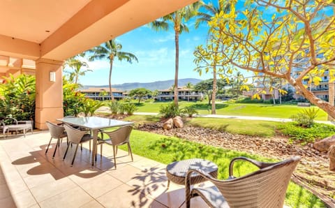 Tranquil patio view with lush greenery and mountain backdrop serenity. HKK-104