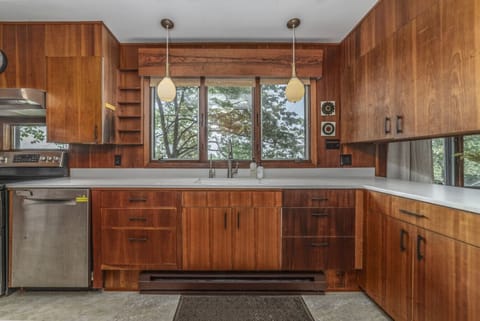 Experience a true mid-century gem! Original cabinetry and classic vintage elements meet a fully stocked kitchen for effortless meals.