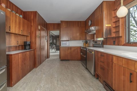 Authentic mid-century kitchen showcasing all original cabinetry and vintage design elements perfectly preserved from the era, fully stocked for a stress free stay.