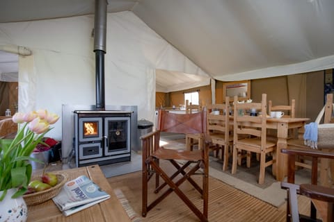 Spacious open plan living area with a log burner