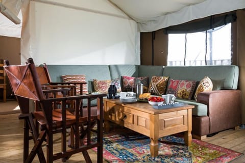 Living room with a six-seater sofa and two individual chairs