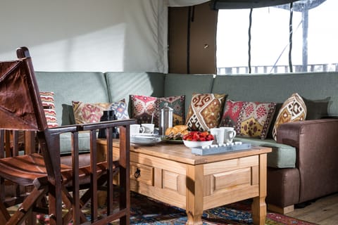 Living room with a six-seater sofa and two individual chairs