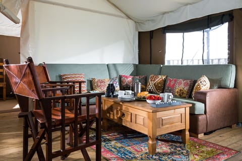 Living room with a six-seater sofa and two individual chairs