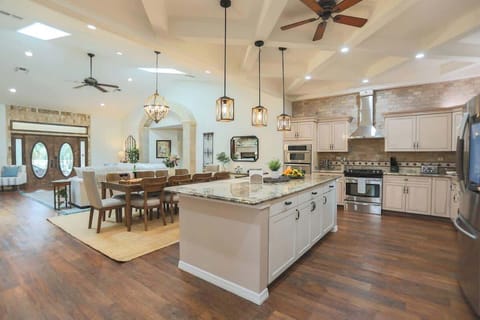 Bright, open, and beautifully styled, the kitchen flows into the main living area, making it the perfect space for entertaining. From pancake breakfasts to sunset dinners, everything happens here.