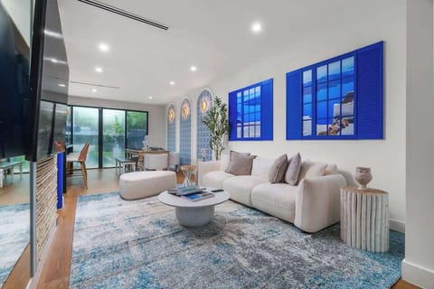Relax in a vibrant and stylish living room, designed with a touch of Mediterranean flair. It's the perfect spot to kick back and unwind after a long day of Miami adventures.