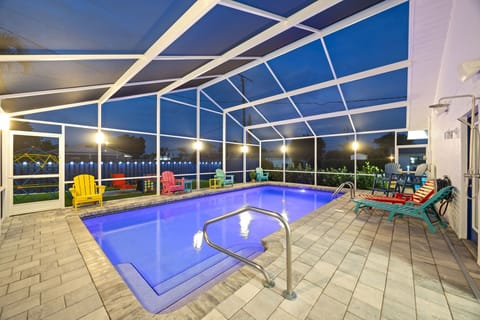 Pool Area - Evening ambiance with pool lighting and lanai