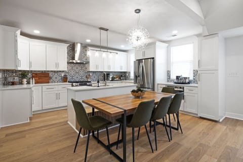 Modern, fully-equipped kitchen and dining area, perfect for group meals.