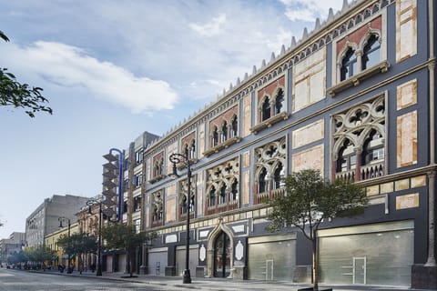 Arrive to a grand landmark facade in the city center.