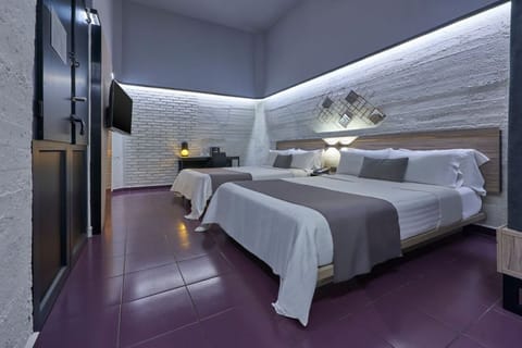 Drift off on plush bedding in a serene, minimalist space.