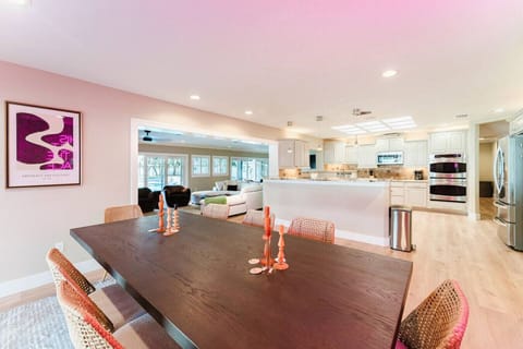 Spacious open-concept living at Indian Shores Escape! Enjoy a stylish dining area, a fully equipped modern kitchen, and a cozy lounge space—all bathed in natural light for the perfect Florida getaway.