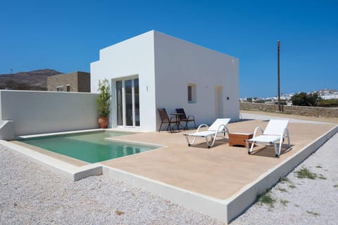 Unwind by the pool with uninterrupted views of the Mykonian landscape.