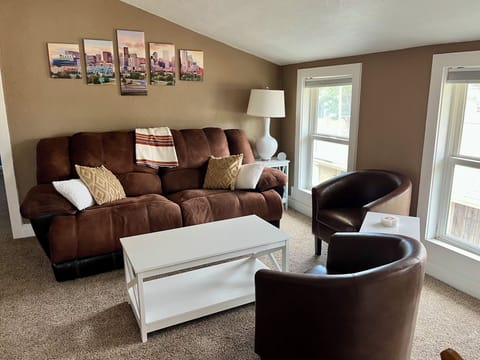 Upstairs living room with Smart TV, mini library, and dedicated work/game table