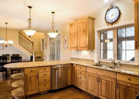 Fully equipped kitchen with granite counter tops, gas stove and double door frig