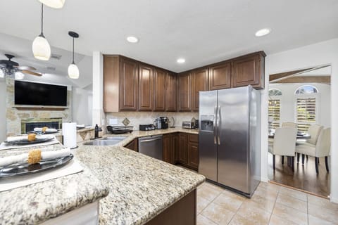 Open kitchen layout connects seamlessly to dining and living areas — ideal for entertaining and family gatherings.