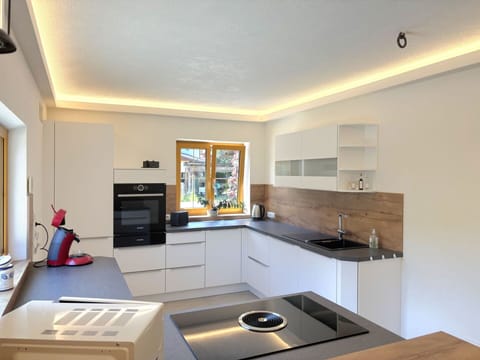 Interior Design, Flooring, Kitchen, Wood, Ceiling, Countertop, Kitchen Appliance, Floor, Home, Lighting