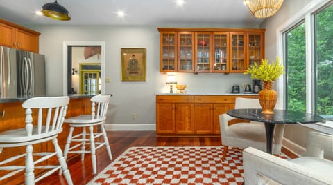 Start your day with coffee at the cozy breakfast table in the kitchen overlooking the backyard deck.