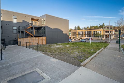 The unit sits behind the wooden fence