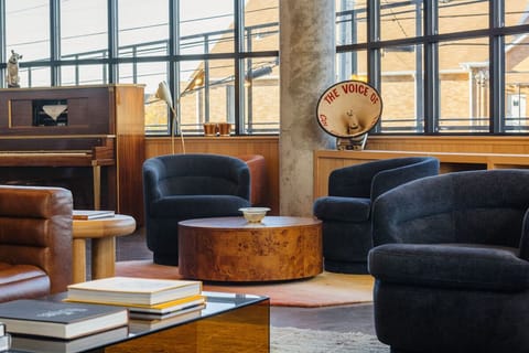 Settle into plush chairs and savor the sunlit city views.