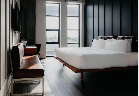 Wake up to sunlight in a sleek, modern king room.