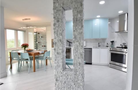 Open-concept living room, dining and kitchen