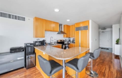 Bar seats and kitchen