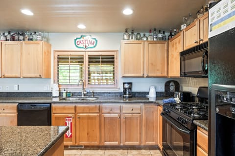 - Fully equipped kitchen with modern appliances and cookware  
- Granite countertops and wooden cabinets for warm character  
- Ideal setup for preparing meals and hosting family dinners
