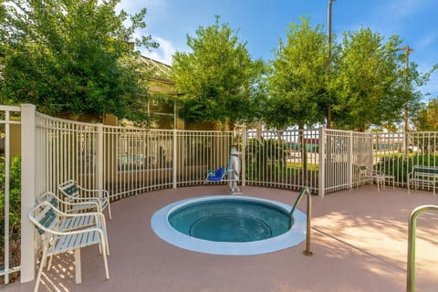 Unwind in the bubbling hot tub after a busy day.