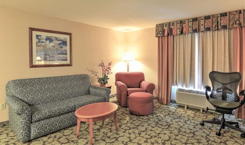 Relax on the cozy sofa beside a soft reading lamp.