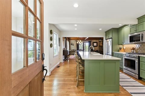 This door welcomes you to the kitchen extending the view to the living room