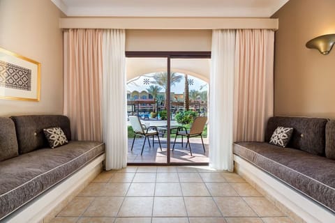 Lounge on built-in sofas and drift into garden views.
