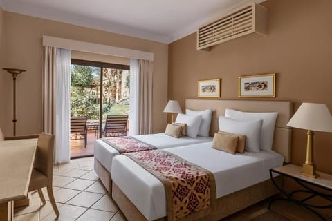 Unwind in twin comfort with garden patio just outside.