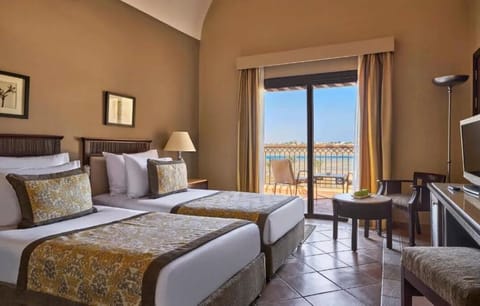 Enjoy coffee by the balcony after a restful twin-bed night.