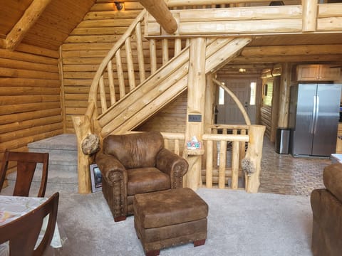 LIVING ROOM: The cute and cozy living room with an extravagant fireplace